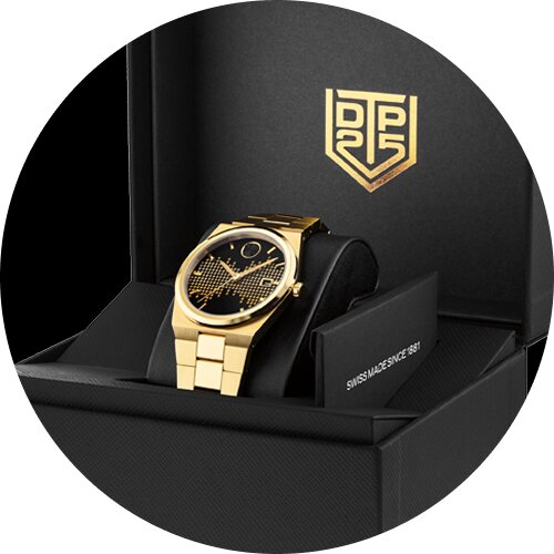 Christian McCaffrey sitting down in a suit wearing a Museum Imperiale watch with blue dial and silver bracelet.