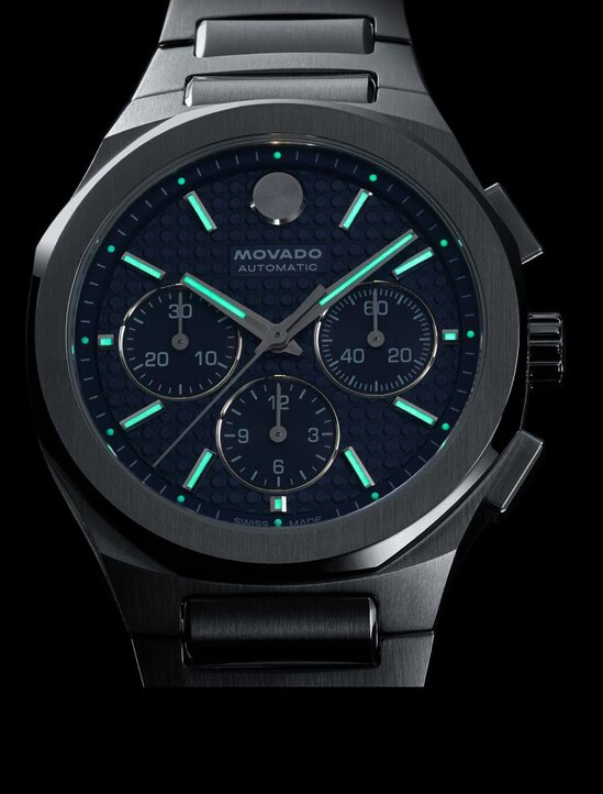 Alta Centurion watch in dim lighting with the Swiss Super-LumiNova® accents glowing on the dial. 