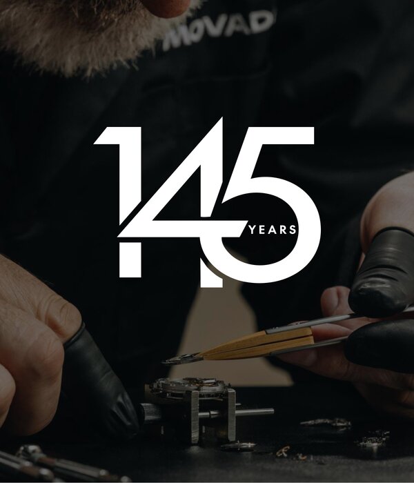 Person putting together an automatic movement with finger gloves. The 145 year Movado logo is on top of the image in white.