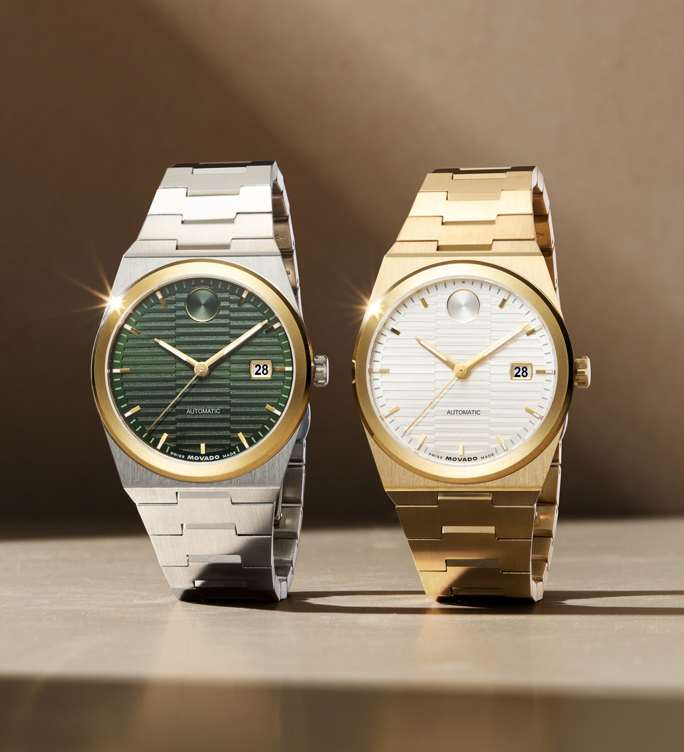 BOLD Quest watch with stainless steel bracelet and green textured dial next to a BOLD Quest watch with gold tone bracelet and white textured dial.