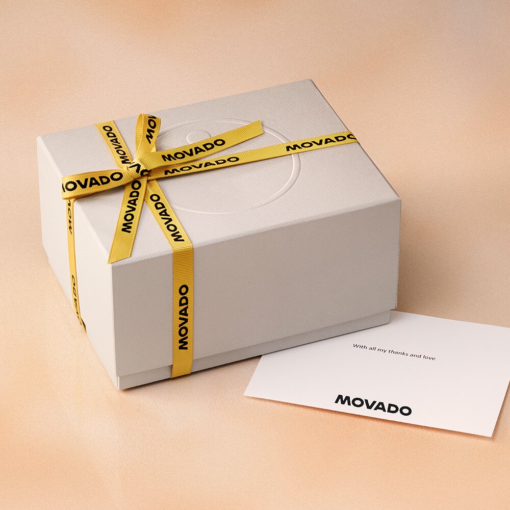 Movado white gift box with branded yellow ribbon and note card with Movado logo