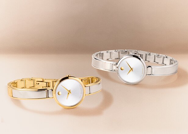 Two tone Moda bangle watches laying next to each other