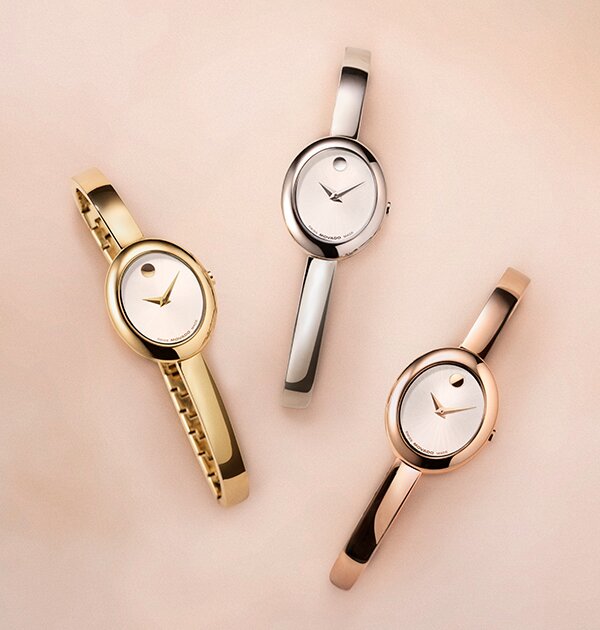 Three Museum Bangles with oval designs; gold tone, silver and rose gold tone