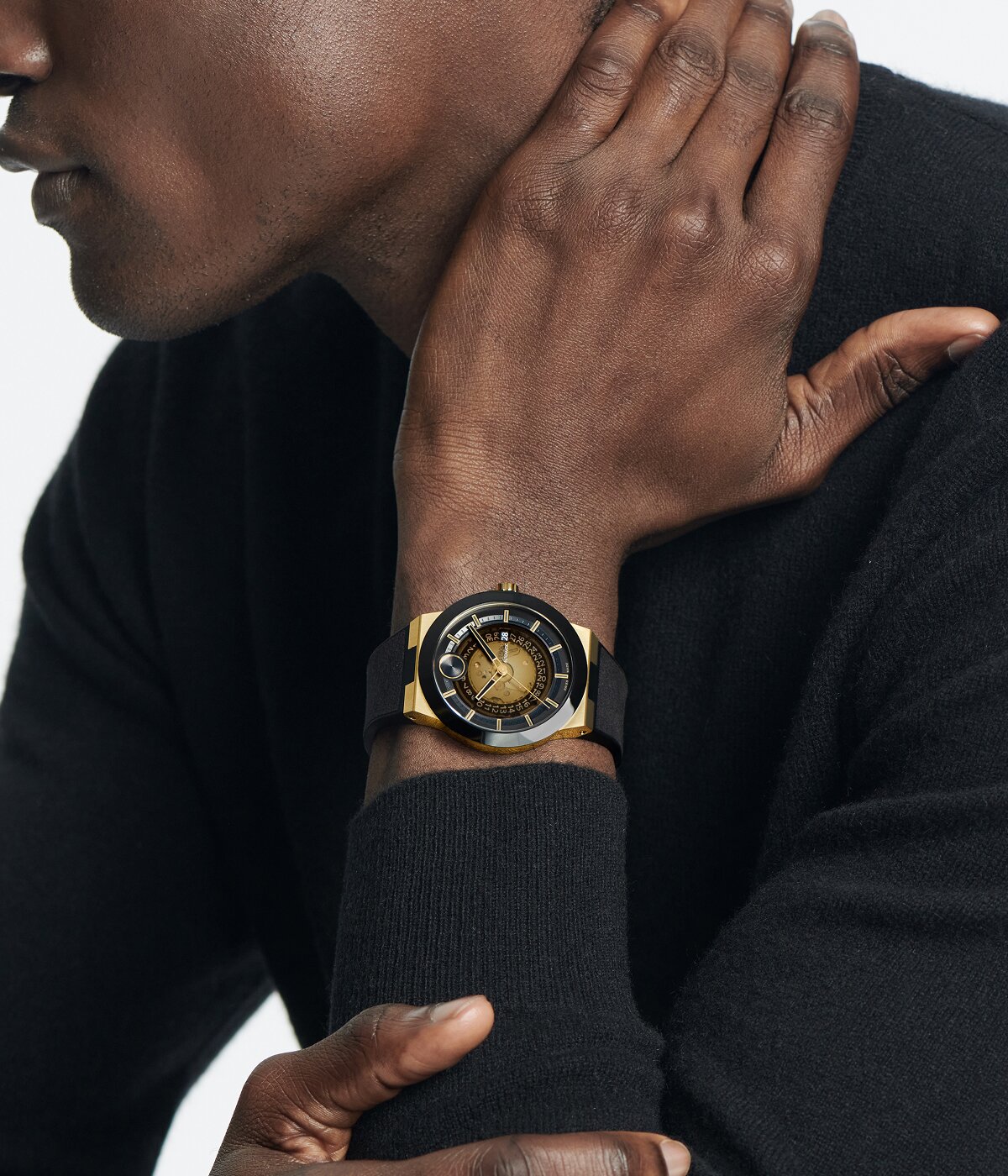 Man wearing the BOLD Fusion Automatic watch with black strap and ceramic bezel.