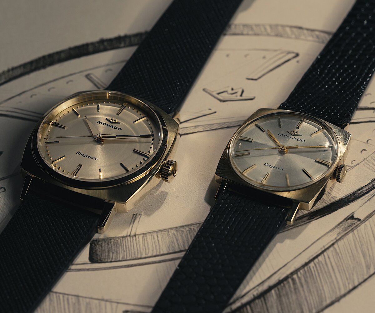Original Heritage Kingmatic watch with black strap and gold square dial laying next to the new Heritage Kingmatic watch in the same color.