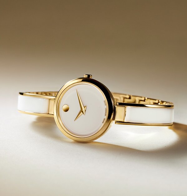 White Moda bangle watch with gold tone accents