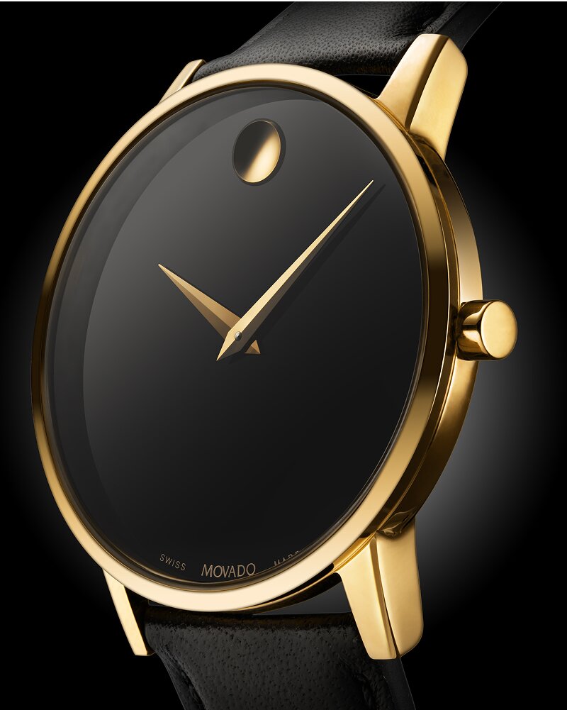 Profile of the black Museum Classic leather strap watch with gold accents