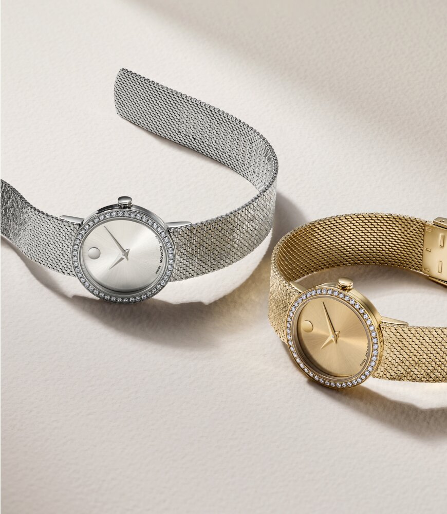 Gold tone and stainless steel Museum Velura watches with mesh bracelets and lab grown diamond bezels.