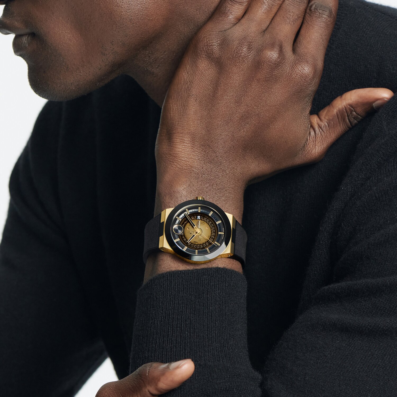Man wearing the BOLD Fusion Automatic watch with black strap and ceramic bezel.