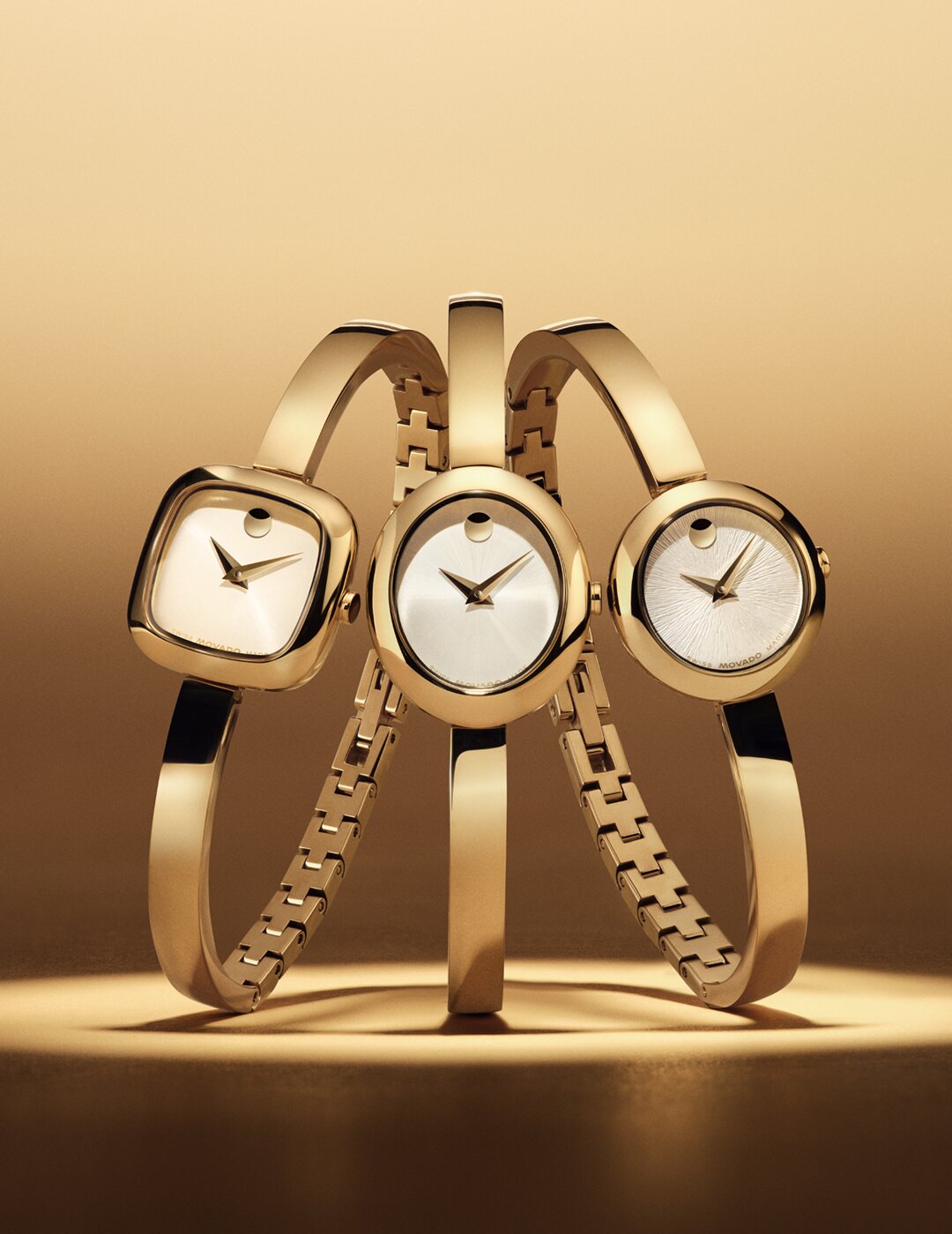 Square, oval and circle dial gold tone bangle watches.