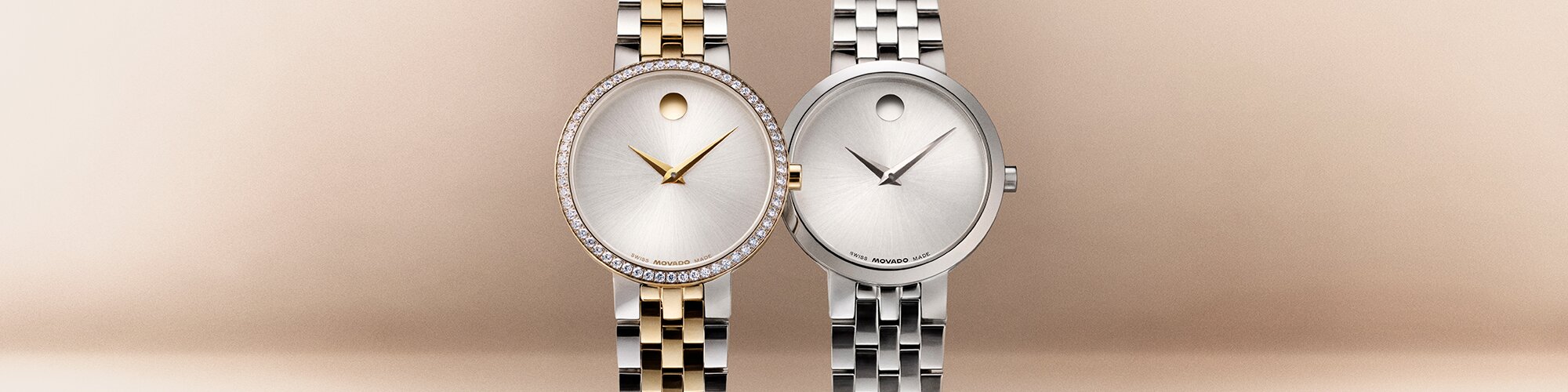 Women's tone Museum Classic bracelet watch with lab grown diamonds next to a women's silver Museum Classic bracelet watch