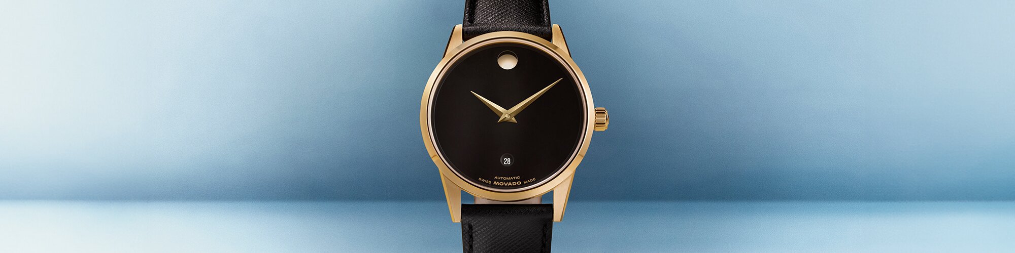 Museum Classic watch with black leather strap and black dial with gold accents
