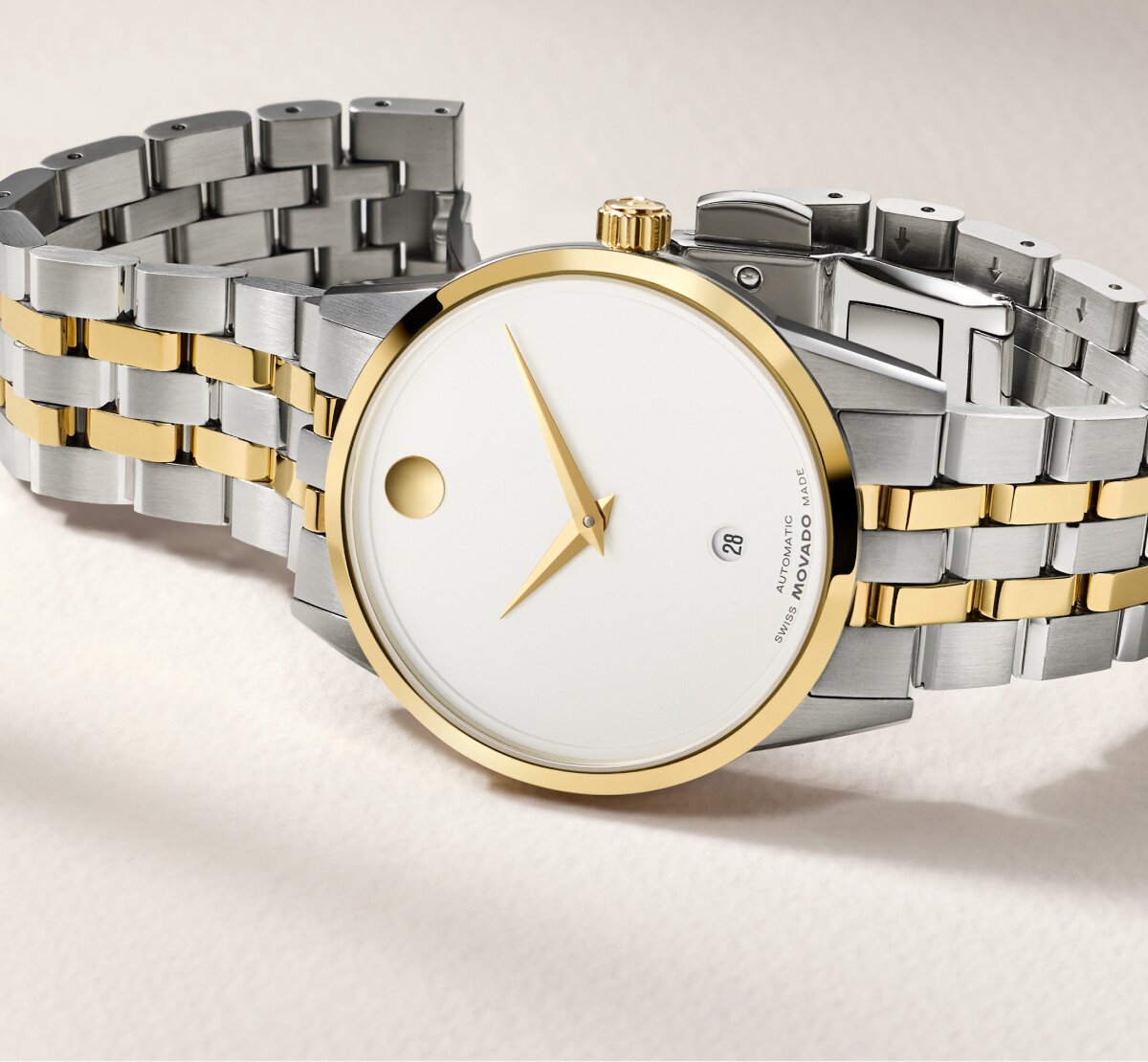 Museum Classic watch with two tone bracelet and white dial.