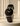 Black Museum Classic watch with leather strap and gold accents.