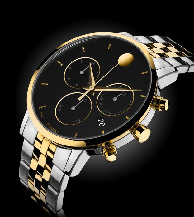 Museum Classic Chronograph watch with two tone bracelet and black dial with gold accents.