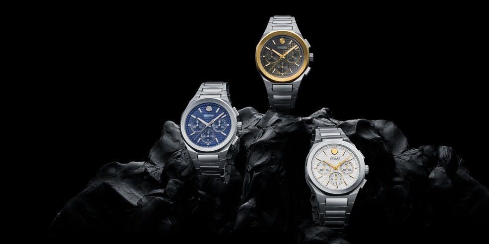 Three Alta Centurion Chronograph watches on a black rock.