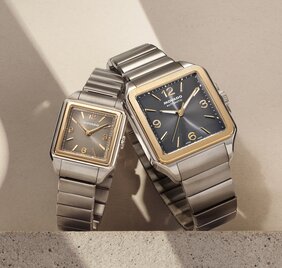 Men's and women's two tone Heritage 1917 bracelet watches with square dials.