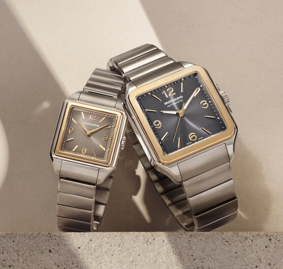 Men's and women's two tone Heritage 1917 bracelet watches with square dials.