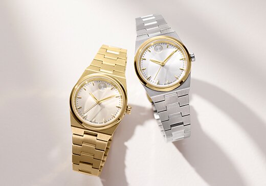 Gold tone BOLD Quest Mini bracelet watches next to a two tone BOLD Quest Mini bracelet watch.