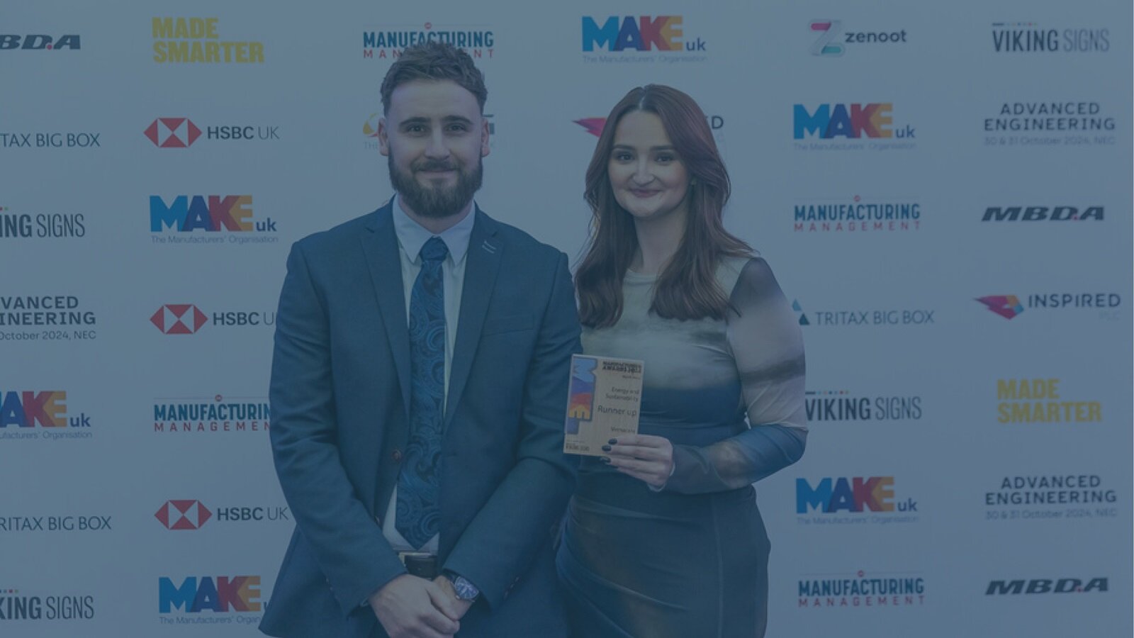 Ben Winterbottom, Group ESG & Sustainability Manager, and Lydia Heap, Global Marketing Communications Executive accepting the award.