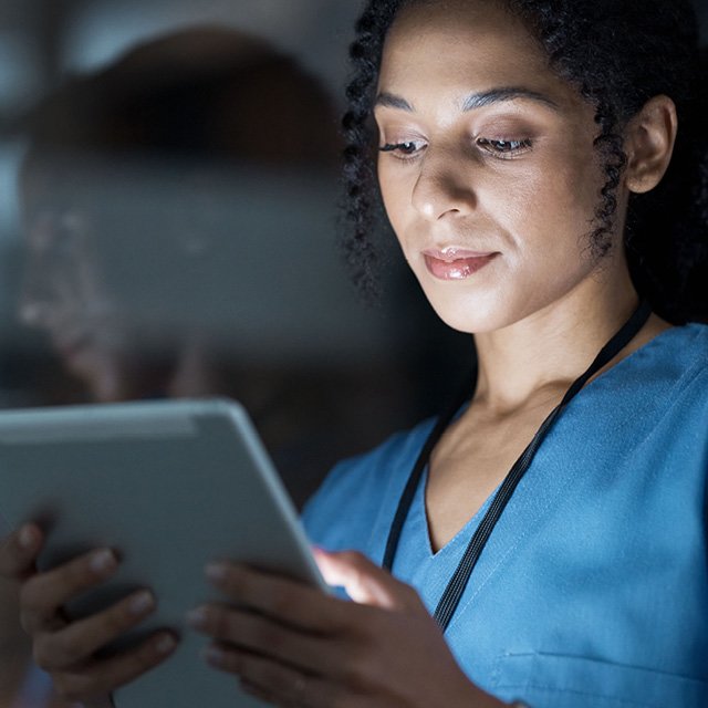 Nurse viewing her tablet