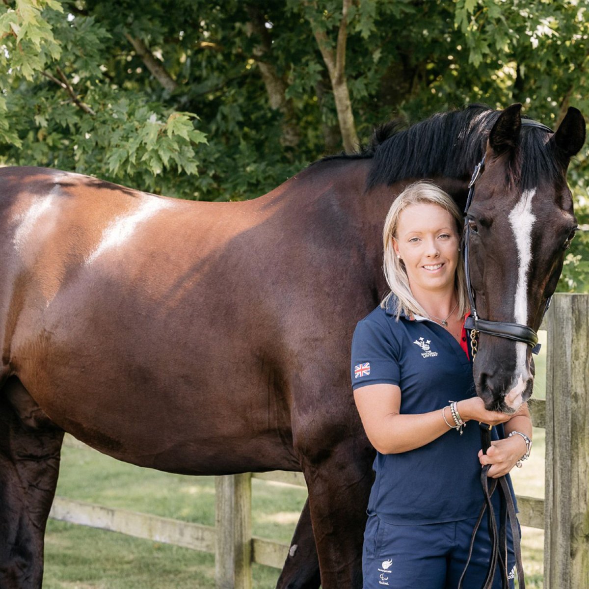 A horse rider with her horse