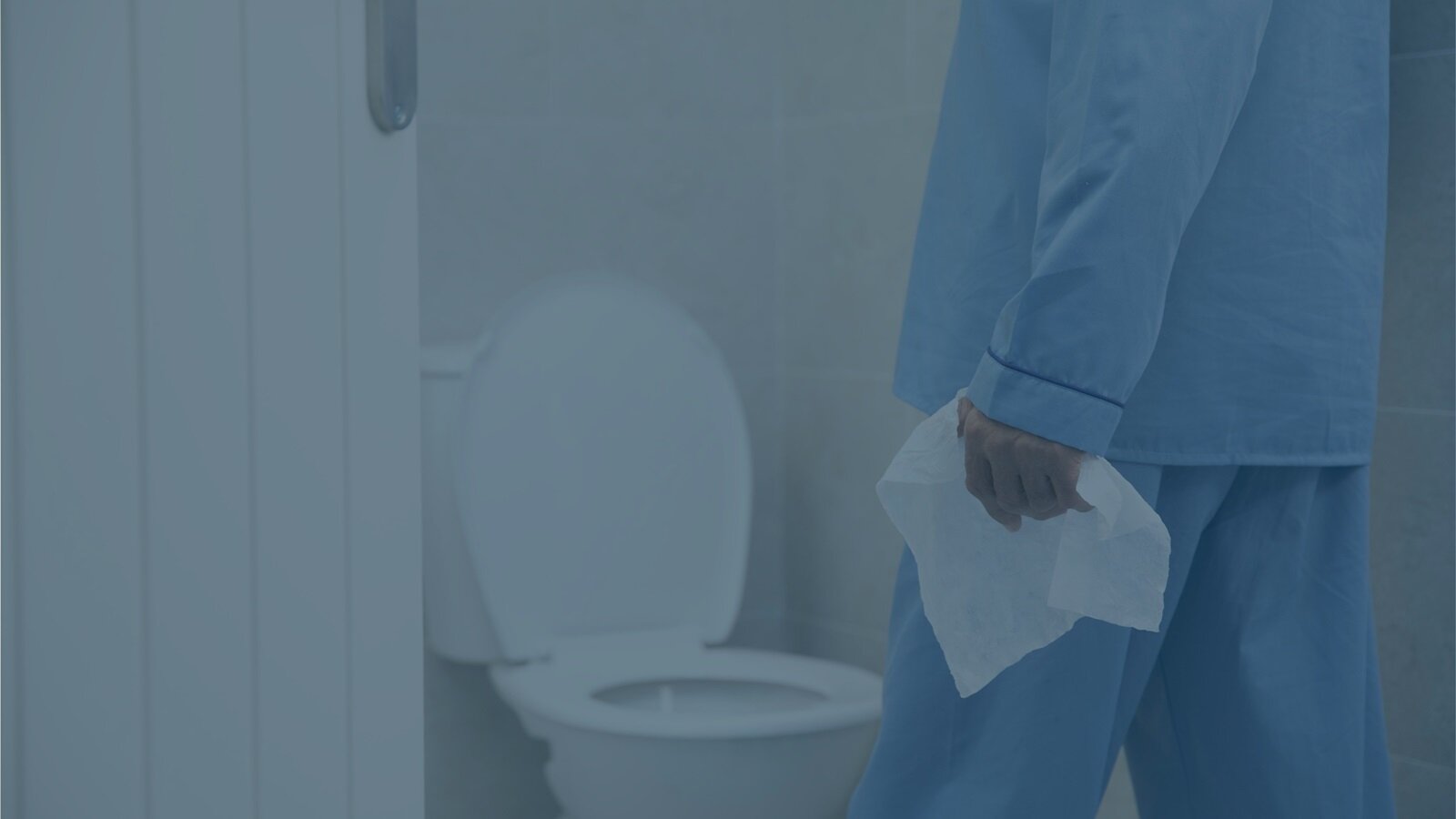 A long term care resident carrying a Conti® Post Toileting Wet Wipe into the bathroom with them 