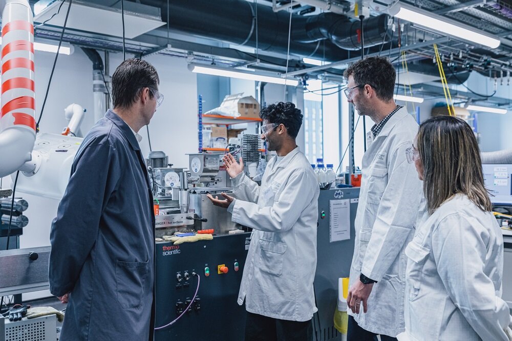 A University of Manchester student, who is working on the project, explaining the process to Alex Hodges while Dr Tom McDonald and Dr Rosa Cueller Franca watch on