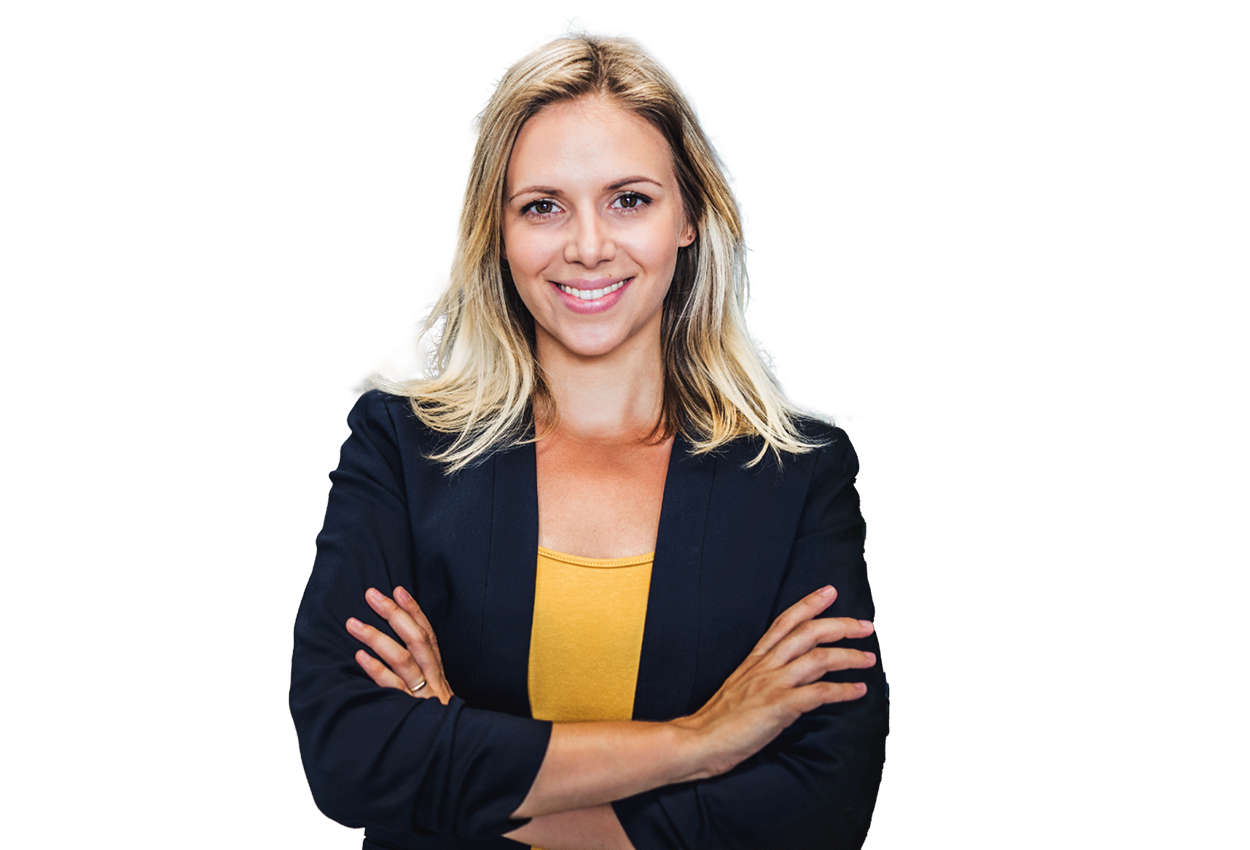 A business woman with arms folded smiling