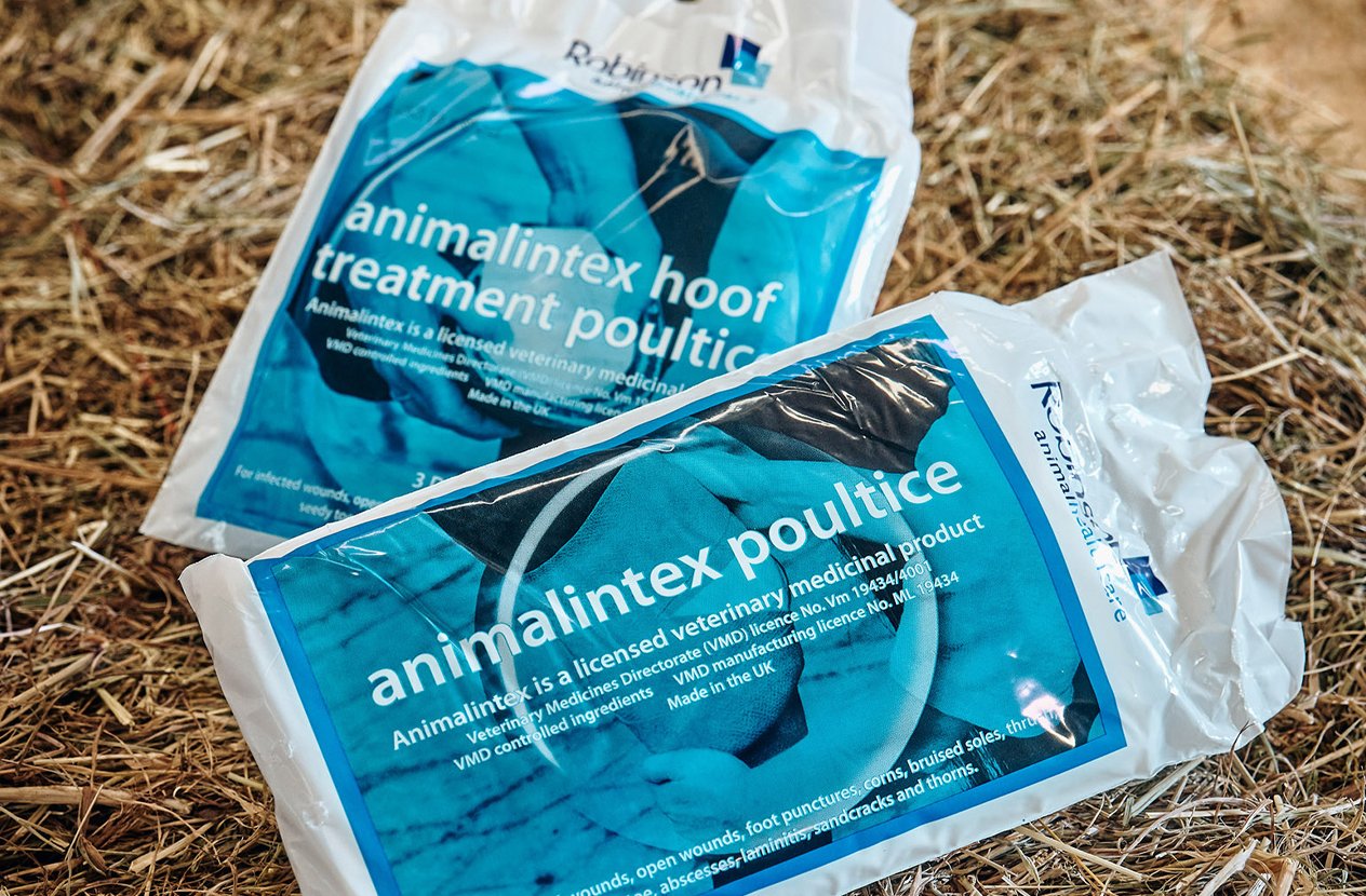 Two animalintex poultice products on hay