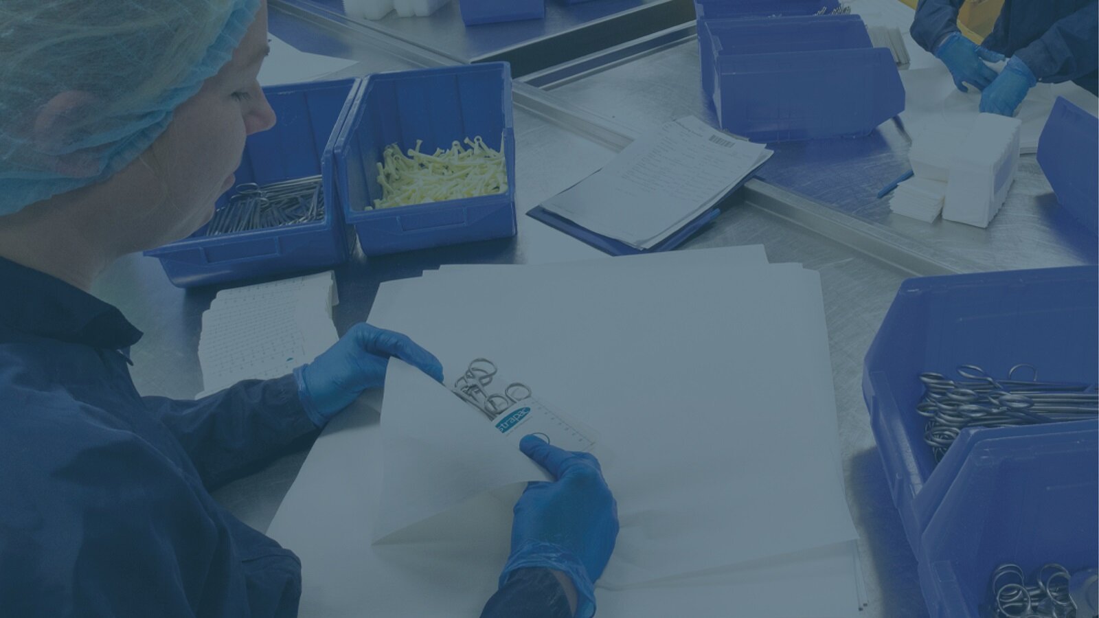 A Vernacare employee packaging medical scissors at their Worksop manufacturing facility