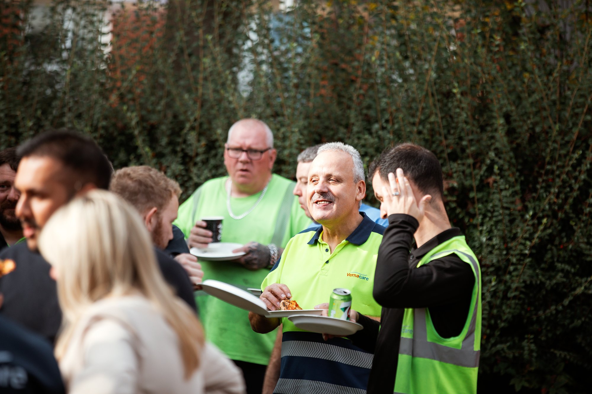 Employees from a warehouse chatting whilst enjoying their lunch