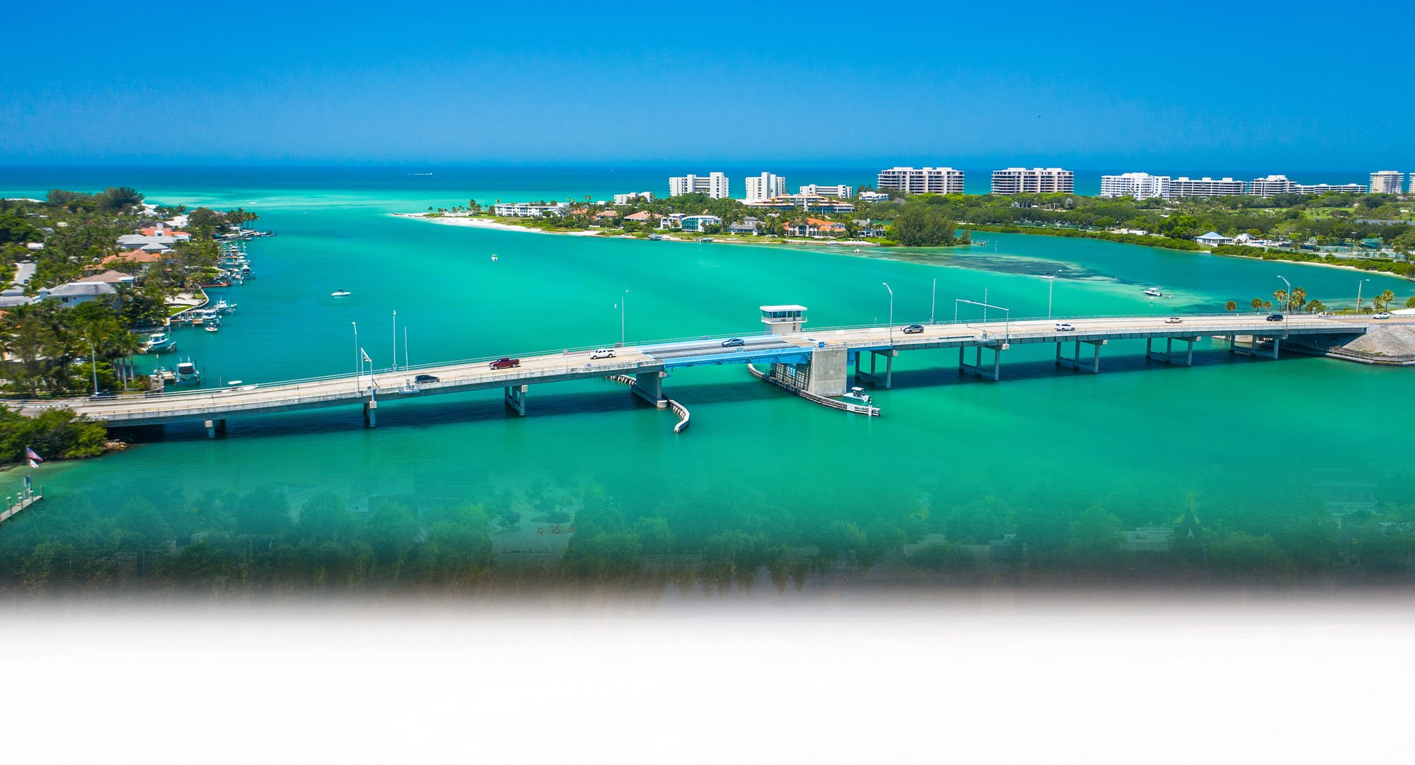 Cross Country Healthcare color photo of Sarasota, Florida with bridge over water in foreground.