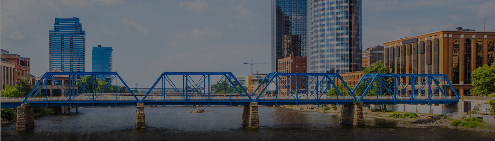 Cross Country Healthcare color photo of the Blue Bridge in front of the cityscape of Grand Rapids.          