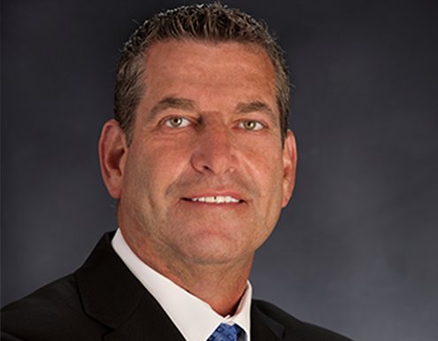 Color portrait photo of Marc Krug, Group President, Delivery. Marc is responsible for the strategic direction and day-to-day business operations for Cross Country Healthcare’s travel nurse and allied divisions. Throughout his almost 30-year career, Marc has held leadership roles in healthcare staffing and human resources. Prior to his career in staffing, Marc practiced law in Boston, MA. His strong track record of growing revenue, improving operational efficiencies, scaling businesses and executing strategies will provide travel nurse & allied continued growth. Marc received a BA from the University of Massachusetts at Amherst, a JD from New England School of Law and an MBA from Boston College Carroll School of Management.               
