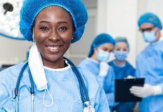 Cross Country color photo three healthcare practitioners wearing scrubs.               