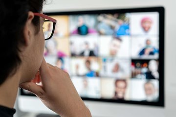 Cross Country Education showing a person attending a virtual meeting.