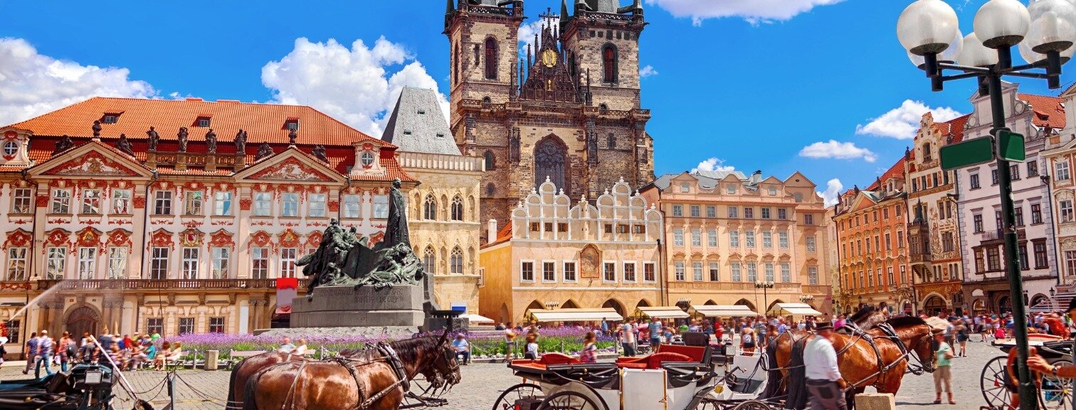 Horse drawn carriages in town square 