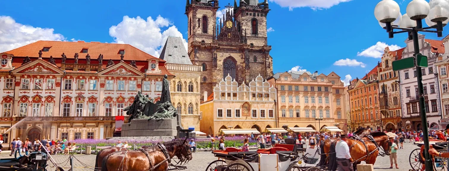 Horse drawn carriages in town square 