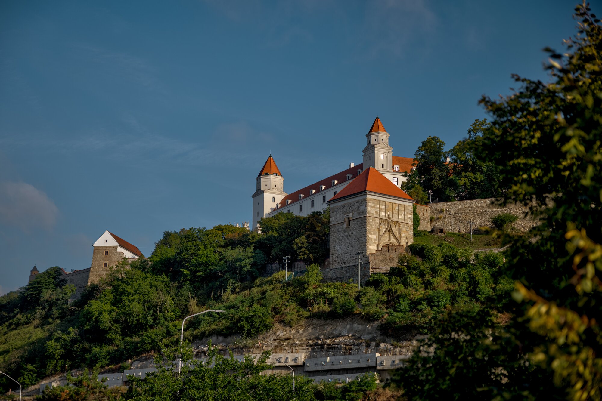 Bratislava, Slovakia – July 24, 2025: Bratislava Castle rises above the city on a hilltop overlooking the Danube River.