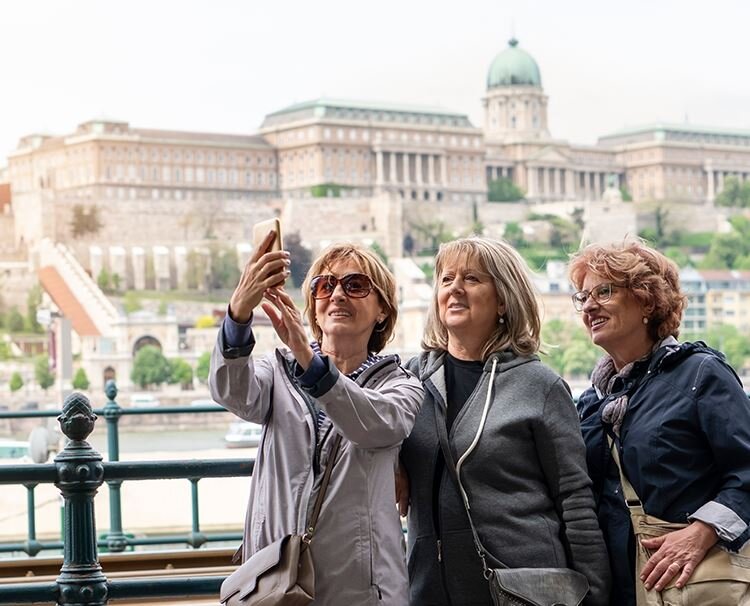 Three guests taking pictures in Budapest