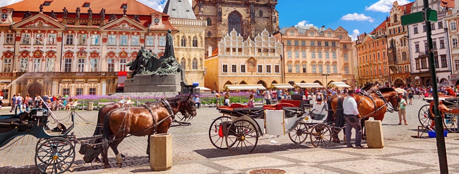 Carriages in front of old town square 