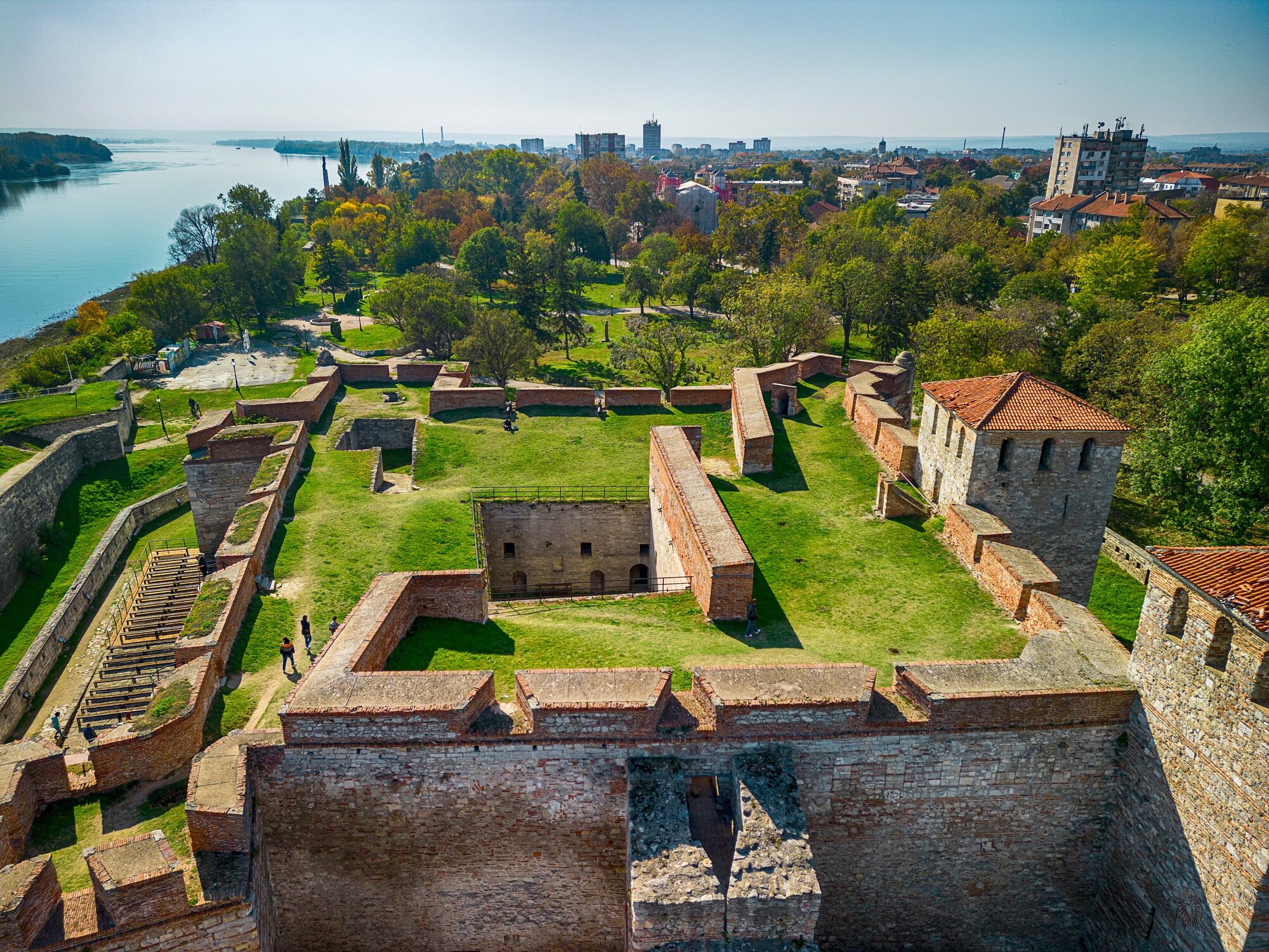 Aerial shot of Baba Vida fortress in Vidin, Bulgaria on the shore of Danube river - impressive and well preserved cultural monument under the golden light of the setting sun