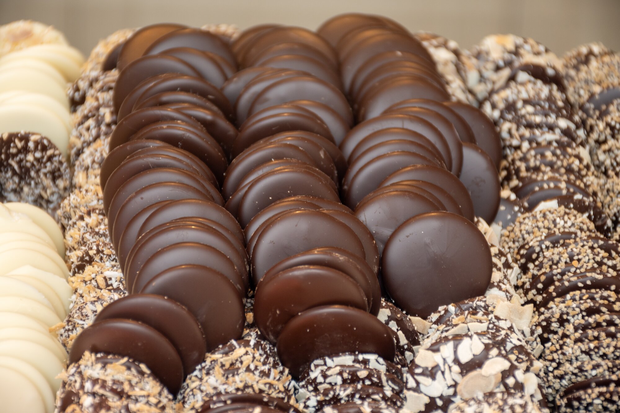 Famous Belgian handmade with no palm oil added chocolate candies on display in confectionery shop in Bruges, Belgium