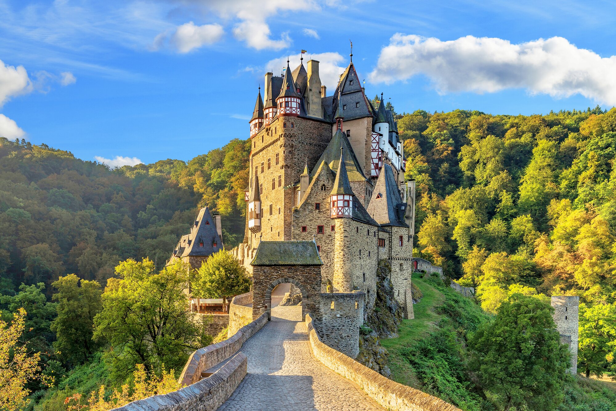 Eltz Castle is a medieval castle nestled in the hills above the Moselle between Koblenz and Trier, Germany. It is still owned by a branch of House of Eltz who have lived there since the 12th century.