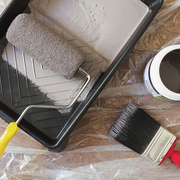 Painting supplies on a clean dropsheet.