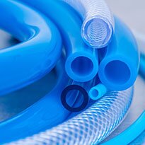 A group of flexible PVC hoses.