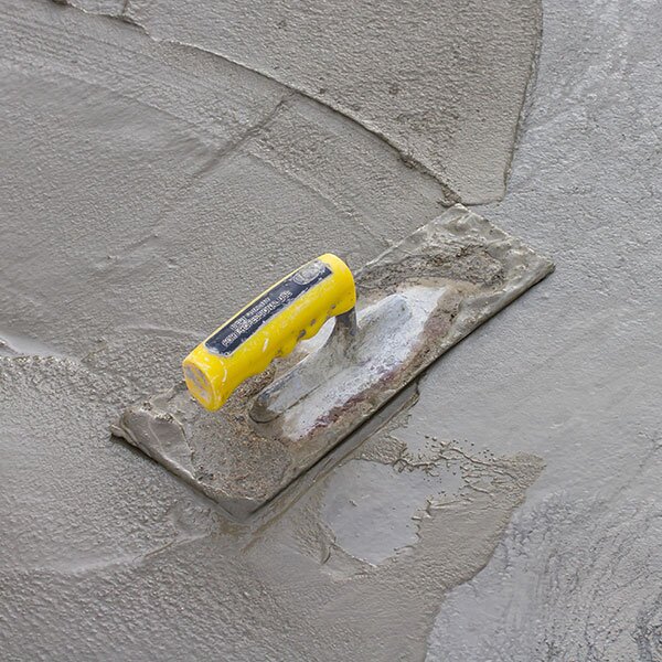 Concrete being used to level surface.