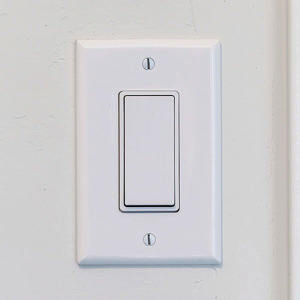 A wallplate on a light switch. 