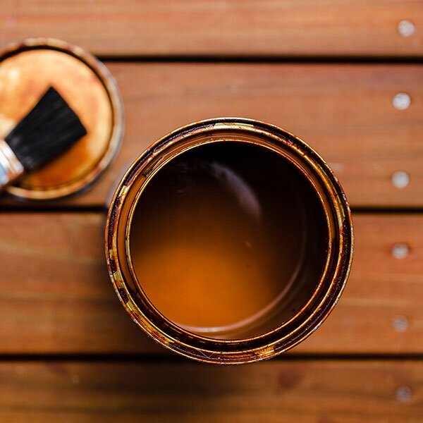 Stain can on a deck.